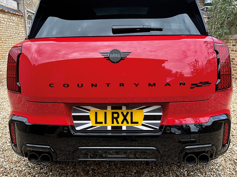 MINI Countryman U25 JCW in red with Fourdot Union Jack Signature shaped rear number plate, featuring a yellow registration and black and white flag design.