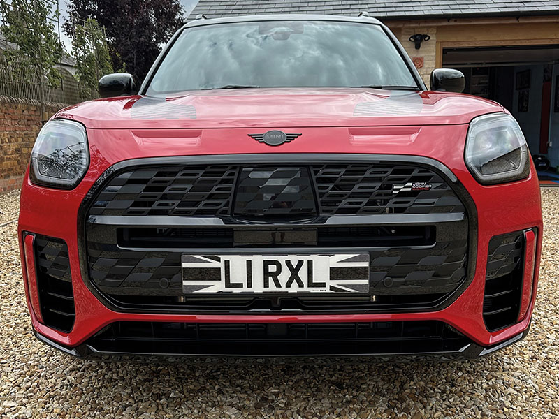 MINI Countryman U25 JCW in red with Fourdot black and white Union Jack front number plate featuring a custom-shaped design.